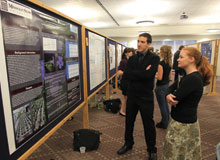 Student consider a presentation at Undergraduate Research Day