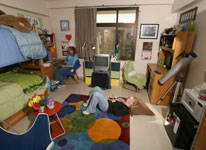 Students lounge in their dorm room