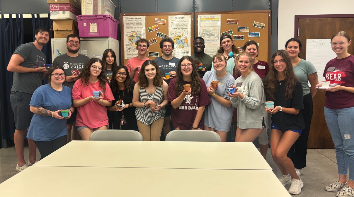 Dean Jahnke and all of the attendees of the STEM LLC social event pose for a photo